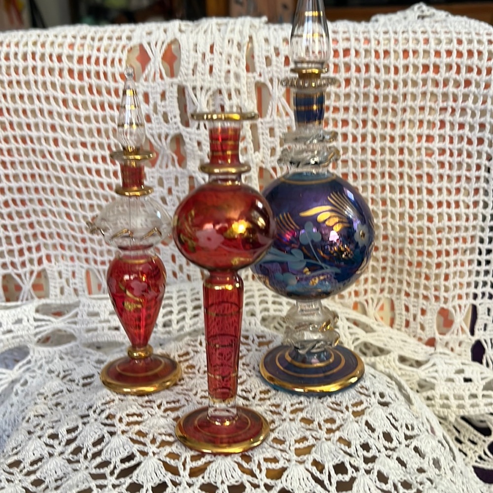 3 very delicate hand blown bottles. 2 have glass tops.